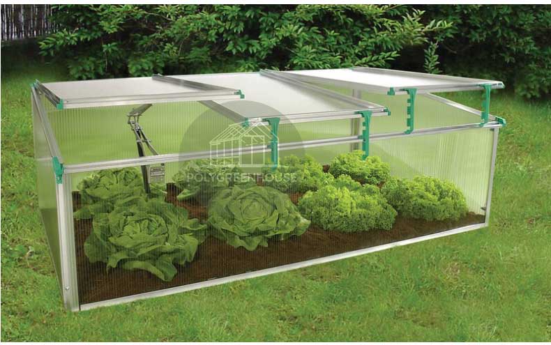 Full view of a mini greenhouse planter box featuring both stainless steel opening and plastic support brackets, with fresh vegetables growing inside.