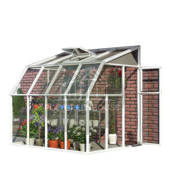 Lean-to greenhouse installed against a wall, made of clear polycarbonate sheets and aluminum frame, shown as a display model